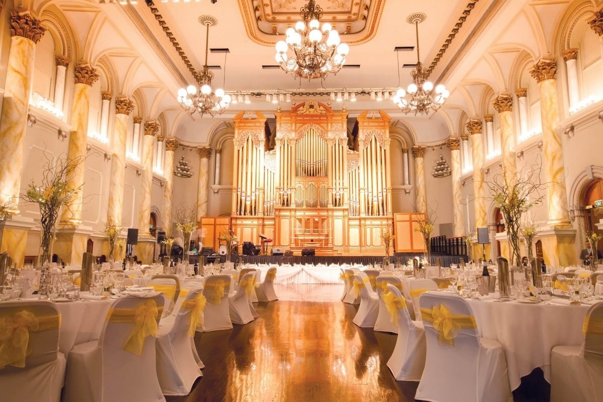 A yellow and white themed wedding setting in the Auditorium