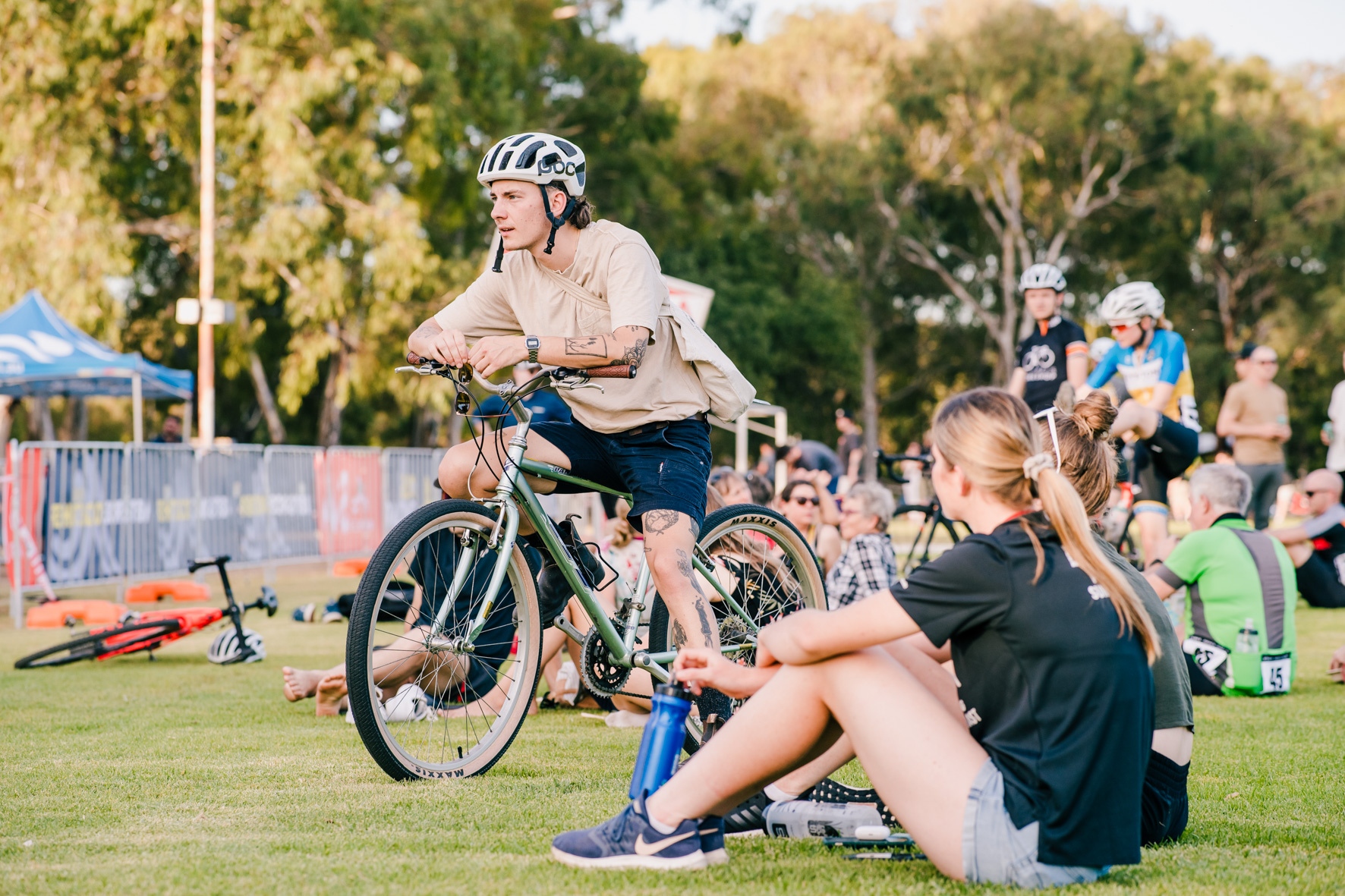 Participants and fans gather in the city parklands for cyclo cross during the Santos Festival of Cycling