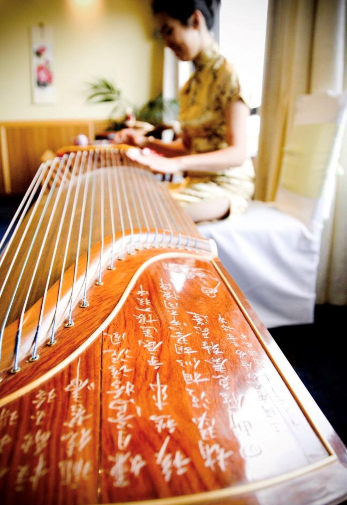 Woman playing Guzheng