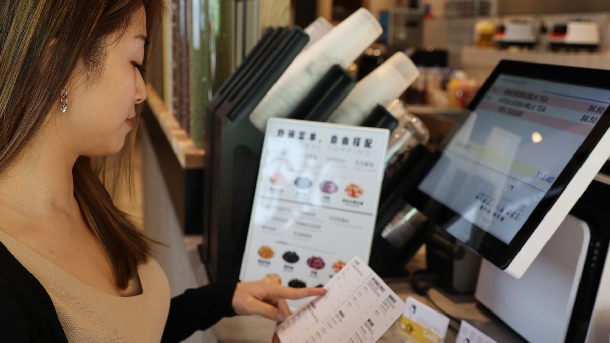 Miko looks at menu at hitea