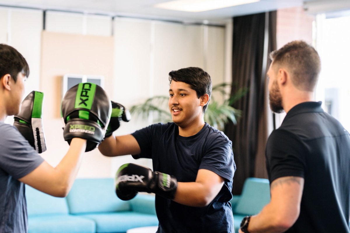 Student boxing in a fitness class