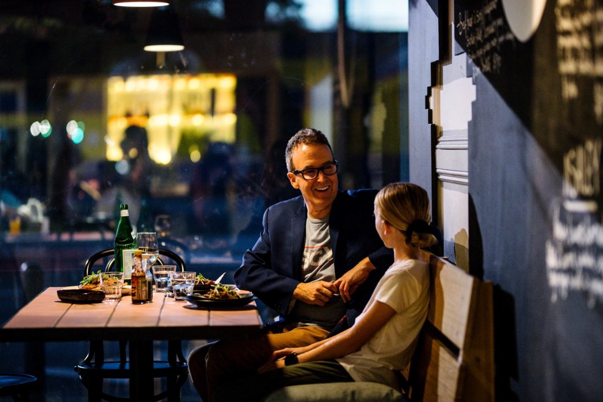 Father and daughter having dinner