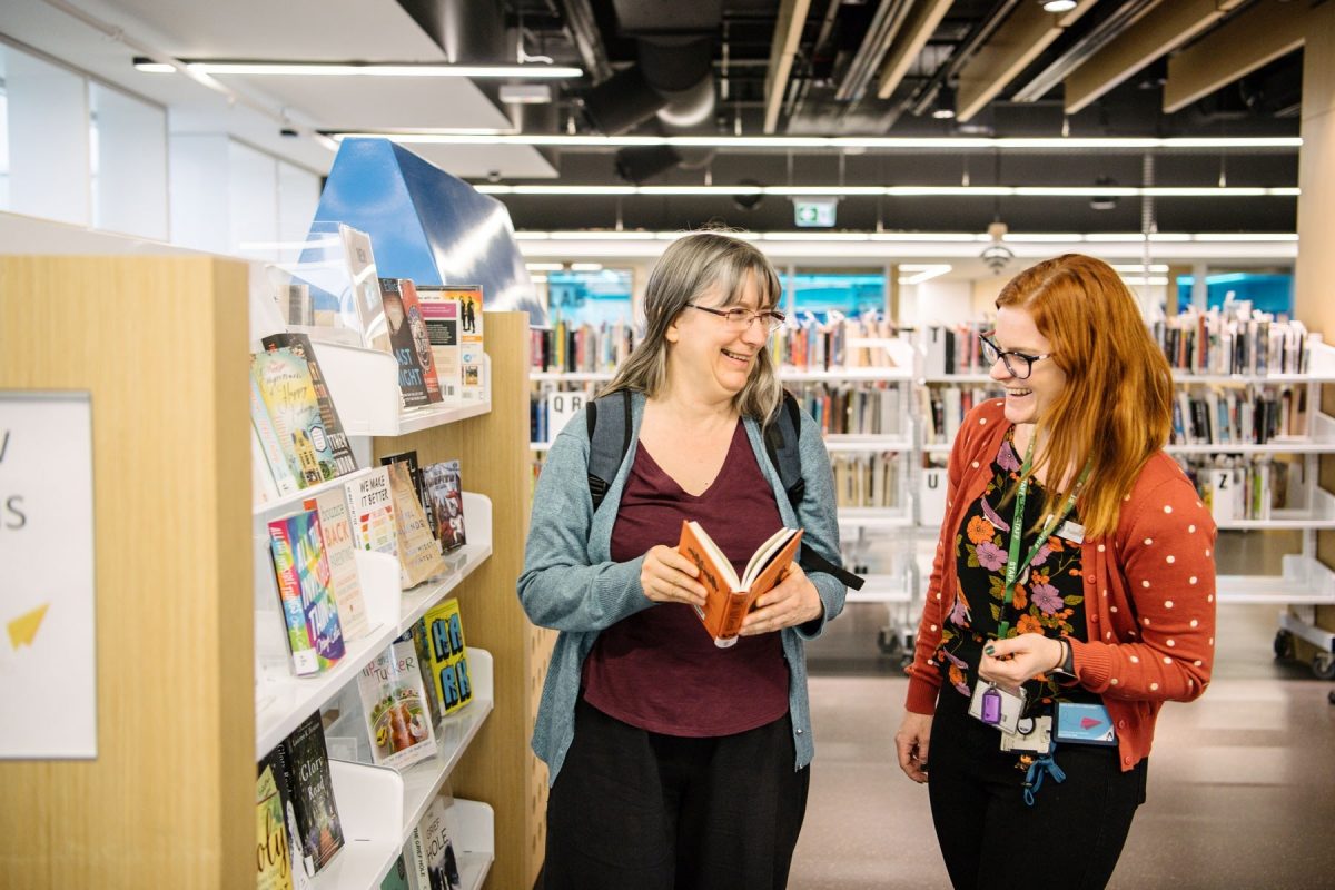 City library user frances with staff member