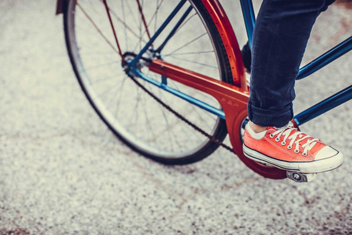 Istock foot on bike wheel AL