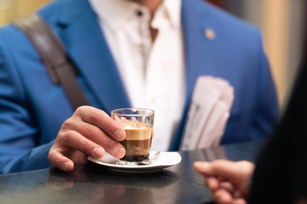 Man standing at coffee counter