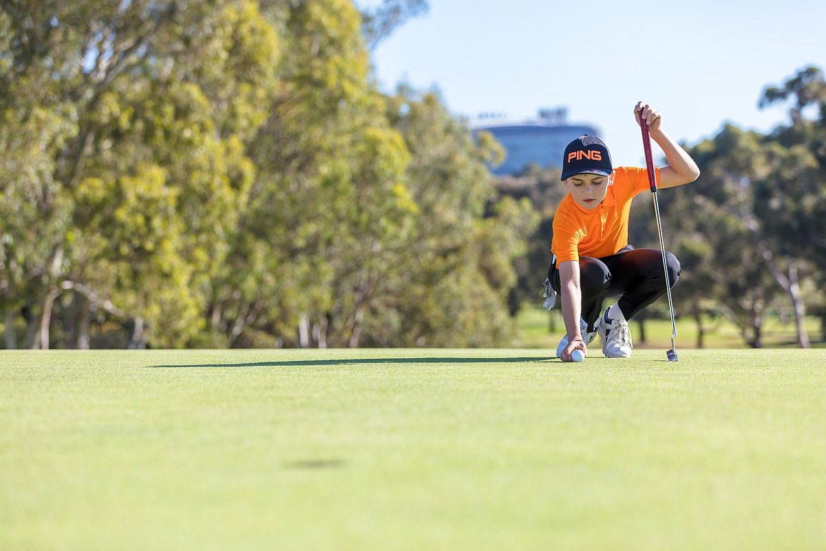 Young boy on golf course