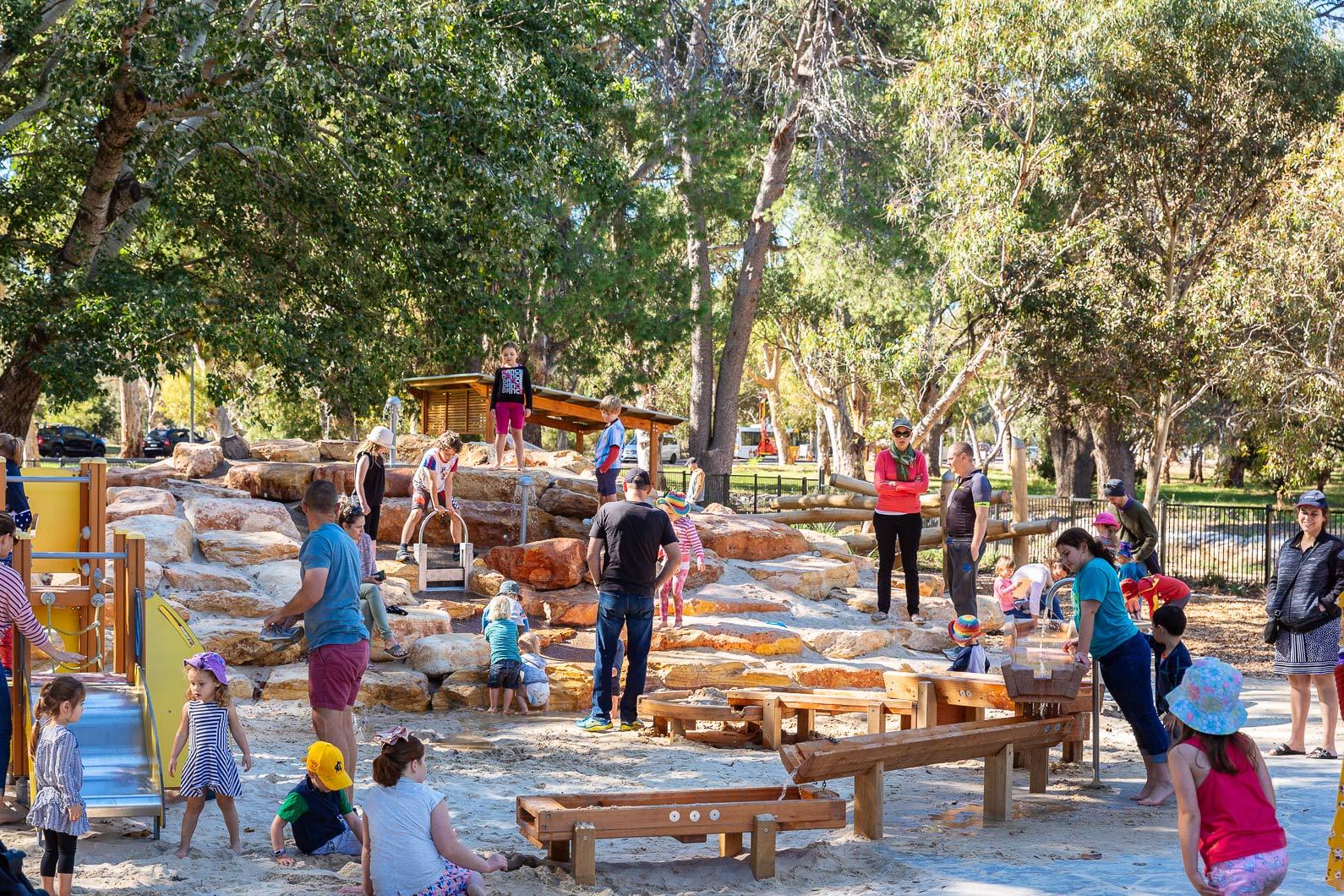 Adults kids playing marshmallow playspace