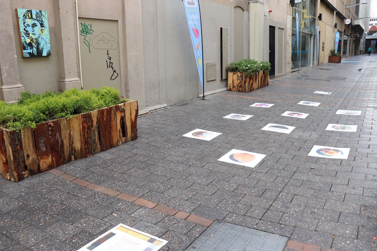 Footpath stickers in Francis St