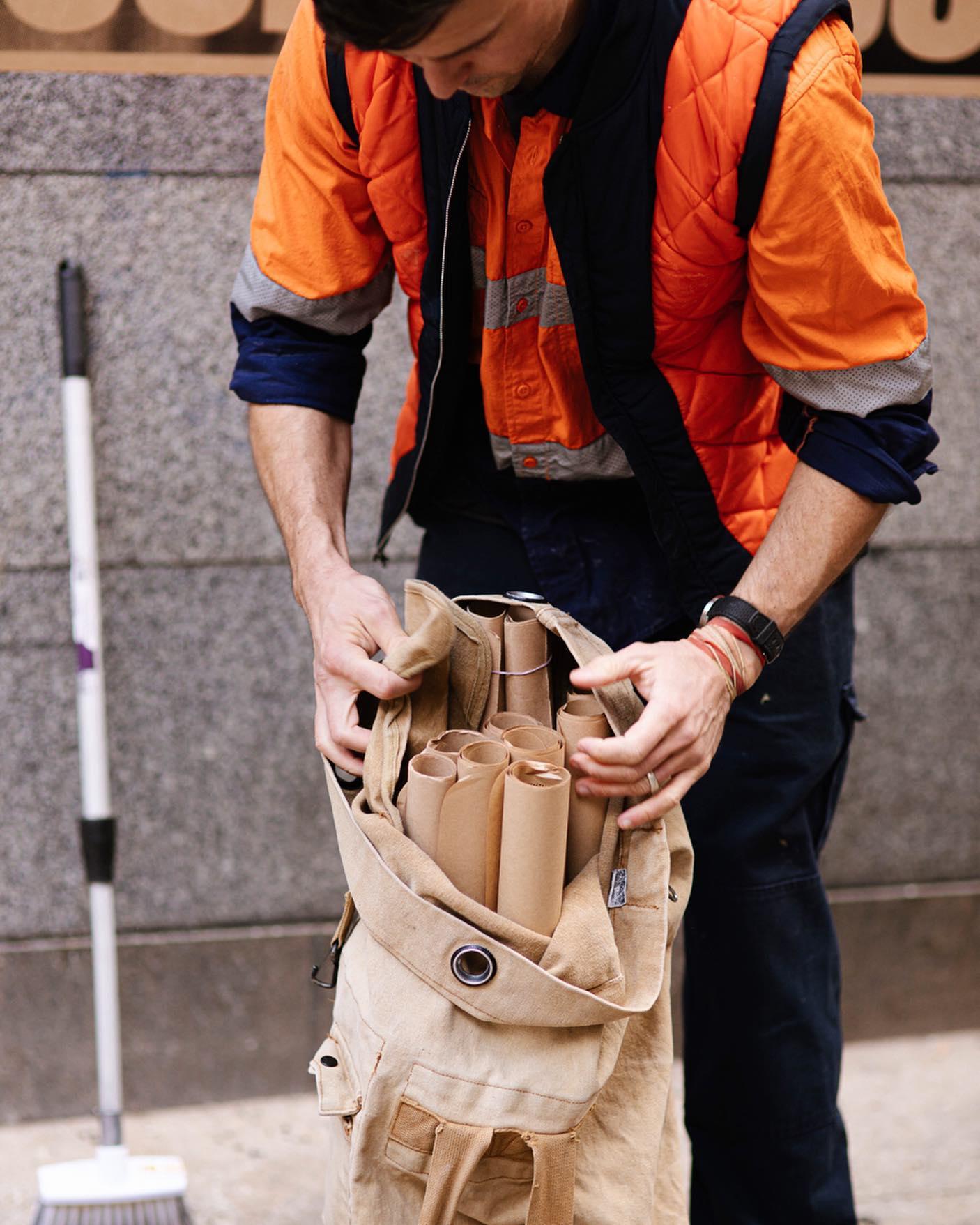 Peter drew with posters in bag