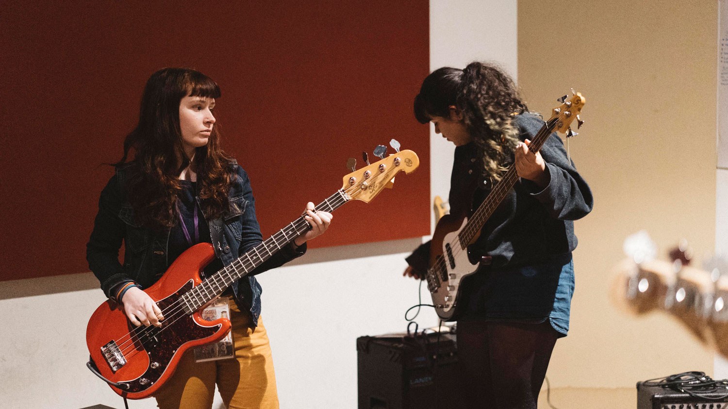 Two girls playing guitar