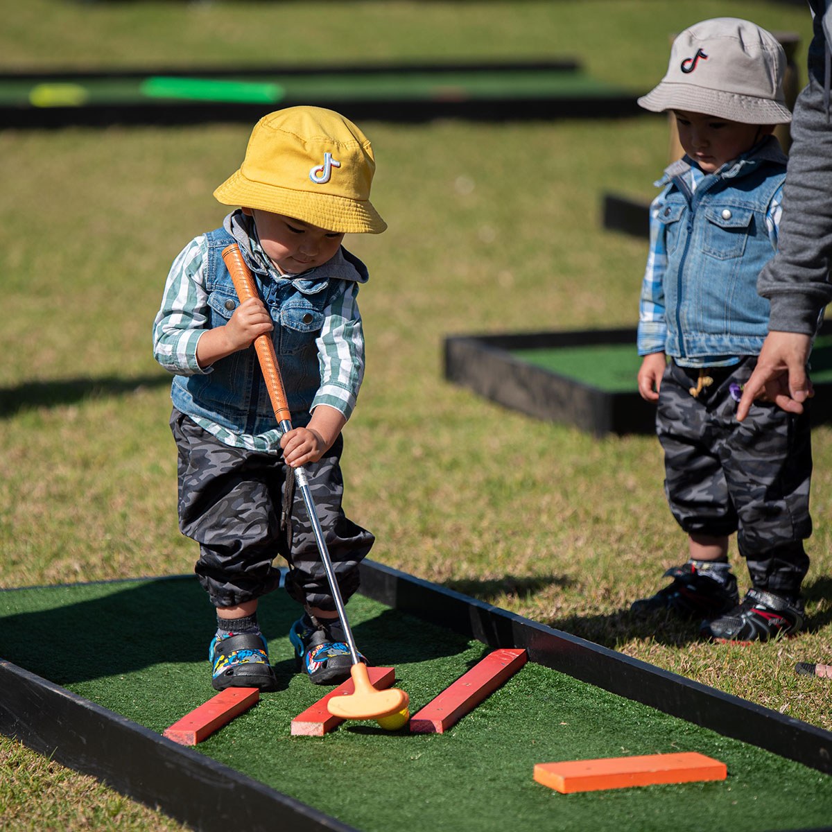 Mini golf two boys