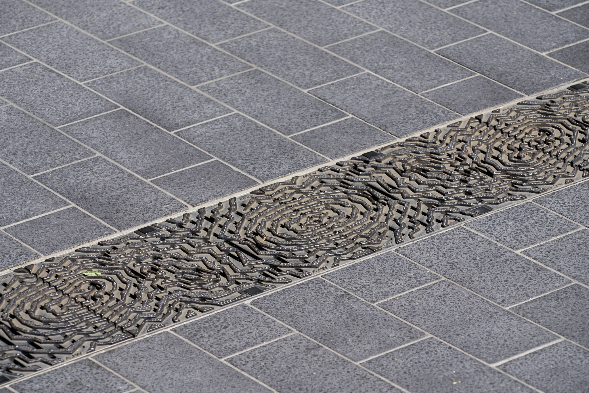 Geode (integrated granite seating and drainage grates) | Art in…